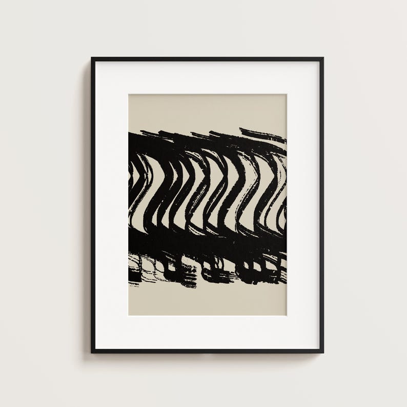 May include: A white ceramic mug with a black handle and the text "But First, Coffee" in a black, bold font. The mug is on a white surface.