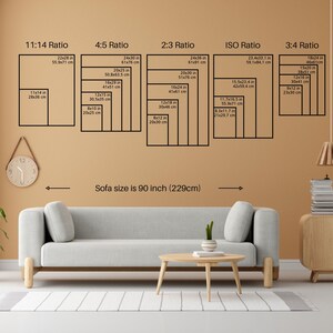 May include: A room interior featuring a light gray sofa, a wooden coffee table, and a wooden side table. The wall displays various rectangular frame sizes, with measurements in inches and centimeters, and the text "Sofa size is 90 inch (229cm)".