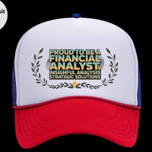 May include: A trucker hat with a white front panel, a red brim, and a blue mesh back. The hat features the text "PROUD TO BE A FINANCIAL ANALYST" in a colorful design, with the words "INSIGHTFUL ANALYSIS STRATEGIC SOLUTIONS" below.