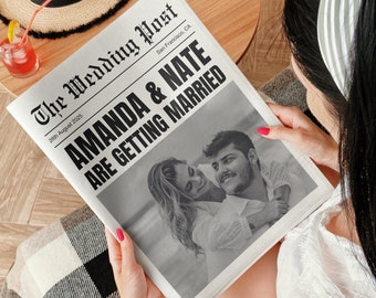 May include: A black and white newspaper headline announcing the wedding of Amanda and Nate on August 26th, 2025 in San Francisco, California. The headline reads "Amanda & Nate Are Getting Married". A black and white photo of the couple is featured below the headline.