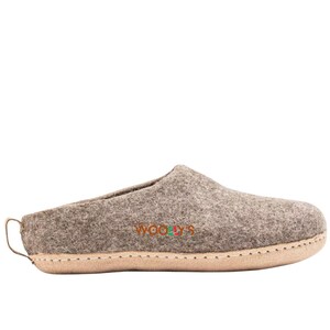 Natural brown indoor slippers made from soft material, lightweight and snug, perfect for keeping your feet warm and relaxed indoors.