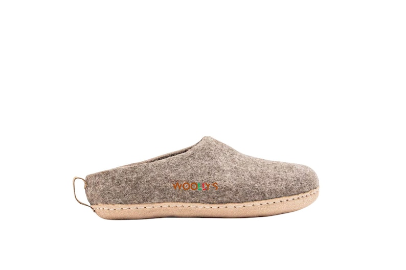 Natural brown indoor slippers made from soft material, lightweight and snug, perfect for keeping your feet warm and relaxed indoors.