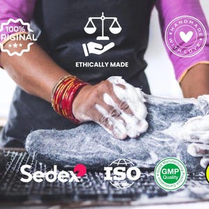 A person washes a gray felt product with soap and water. The product is handmade with love and ethically made. The image includes the text "100% Original", "Ethically Made", "Handmade with Love", "CE", "Sedex", "ISO", "GMP Quality", and "Woolly's".