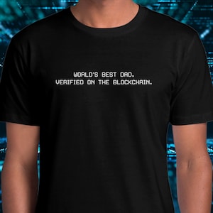 May include: Black t-shirt with white text that reads "World's Best Dad. Verified on the Blockchain."