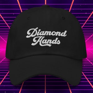 May include: A black baseball cap with white embroidered text that reads "Diamond Hands".