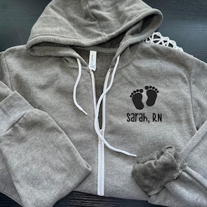 Embroidered Bella Canvas Name and Baby Feet Zip-Up Jacket, Nurse Full Zip Jacket, L&D Nurse Jacket, Postpartum/Mother-Baby Nurse, NICU Nurse