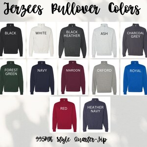 May include: A selection of Jerzees quarter-zip pullovers in a range of colours, such as black, white, and navy. The image displays the available colours: black, white, black heather, ash, charcoal grey, forest green, navy, maroon, oxford, royal, red, and heather navy.
