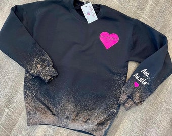 Custom reverse dye sweatshirt with personalized names on sleeve