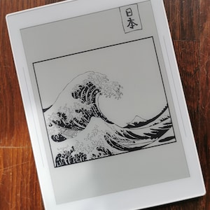 May include: A black and white illustration of a large wave crashing against a mountain, with the Japanese word "日本" (Japan) written in the top right corner.