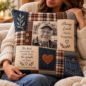 May include: A square patchwork pillow featuring a central black and white photograph of an older man wearing a cap. The pillow includes fabric panels with brown plaid, blue denim, and cream textures, two small buttons, a brown heart patch, and text.