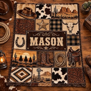 May include: A rectangular blanket featuring a patchwork design with western motifs including a cowboy hat, cowhide patterns, a desert landscape, a steer skull, a horseshoe, a saddle, boots, and the name MASON centered in a dark brown panel.