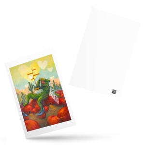 May include: A rectangular postcard featuring a painting of a green frog-like figure wearing a crown and a blue high-heeled shoe, sitting on red round fruits in a desert landscape with cacti, a signpost, and yellow heart shapes in the sky.