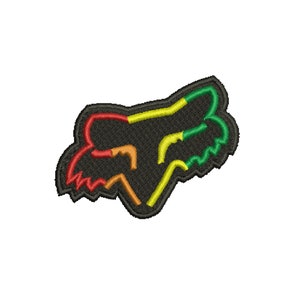 May include: Embroidered patch featuring the Fox Racing logo. The logo is a stylized fox head in black, outlined with red, orange, yellow, green, and yellow stitching. The patch is designed for application on apparel or accessories.