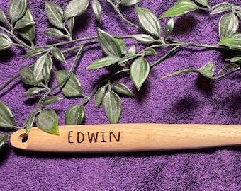 Wooden spoon with desired text. Spatula with desired text