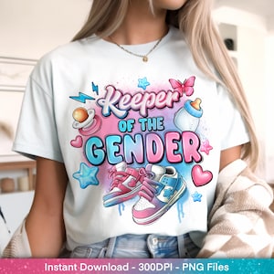 May include: White t-shirt with a colorful graphic that reads "Keeper of the Gender." The design includes a pacifier, baby bottle, stars, hearts, and sneakers in pink and blue. A pink butterfly is also featured.