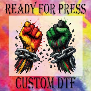 May include: A digital graphic featuring two clenched fists, one in red, yellow, and black, the other in green, black, and red, each bound by a silver chain. The words "READY FOR PRESS" and "CUSTOM DTF" are displayed.