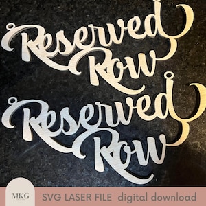 May include: Two wooden signs with the text "Reserved Row" in a cursive font. The signs are cut out and have a natural wood finish.