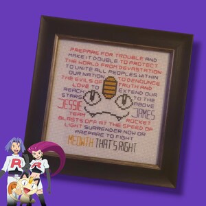 May include: A framed cross-stitch design featuring the iconic Team Rocket motto from the Pokemon anime series. The text reads "Prepare for trouble and make it double to protect the world from devastation. To unite all peoples within our nation, to denounce truth and extend our love to the stars above. Jessie, James, Rocket blasts off at the speed of light. Surrender now or prepare to fight. Meowth that's right."