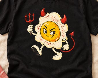 Gefülltes Ei (PNG), Lustige Grafik eines Spiegeleis mit Teufelsmotiv, Retro-Frühstücks-Shirt-Design