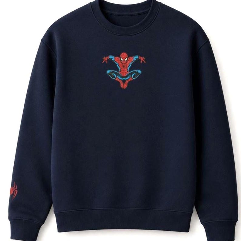 May include: Navy blue sweatshirt featuring a red and blue Spider-Man graphic on the chest. A smaller Spider-Man logo is on the left sleeve. The crew neck sweatshirt is made of a soft material.