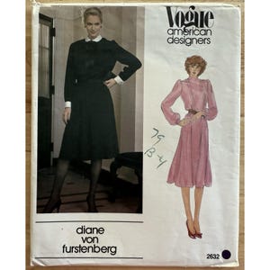 May include: Vogue American Designers sewing pattern featuring two Diane von Furstenberg dress designs. The pattern envelope shows a woman in a long-sleeved black dress with a white collar and cuffs, and a pink dress with long sleeves.