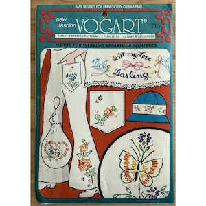 May include: Vintage Vogart 713 repeat transfer patterns for embroidery or painting. The package features designs for apparel and domestic use, including floral motifs, a butterfly, and the text "All my Love Darling."
