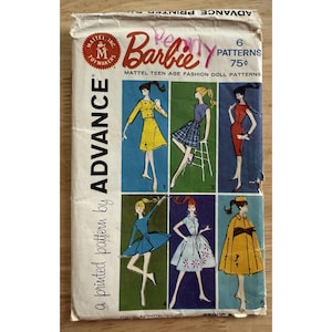May include: Vintage Barbie pattern packet featuring six fashion designs for teen dolls. The packet has a white background with colorful illustrations of the outfits. The text "Barbie" is prominently displayed.