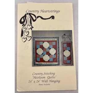 May include: A cream-colored paper with the text "Country Heartstrings" and a decorative bow and hearts. The image shows two small quilts, one square and one rectangular, with the text "Friends are like Heirloom Quilts" and "Always to be Treasured". The text "Country Stitching 'Heirloom Quilts' 24" x 24" Wall Hanging" is also visible.