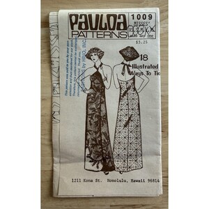 May include: A vintage Paula Patterns sewing pattern envelope, number 1009, featuring illustrations of two floor-length halter dresses. The front displays the text 'Paula Patterns', '18 Illustrated Ways To Tie', and the address 1211 Kona St. Honolulu, Hawaii.