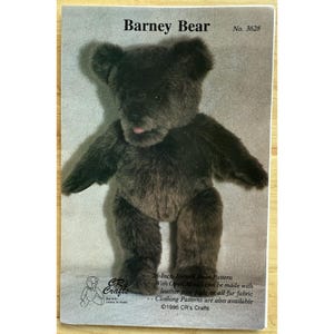 May include: A pattern for a 28-inch jointed Barney Bear plush toy. The image shows the finished bear with dark brown fur, a pink tongue, and the text "Barney Bear" and "No. 3628". The pattern includes instructions for open mouth and leather paw pads.