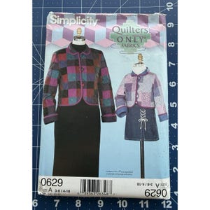 May include: Simplicity sewing pattern showing quilted jackets and a denim skirt. The pattern features a patchwork jacket in purple, green, and black. The pattern number is 0629, and the size is A 3-8/4-18.