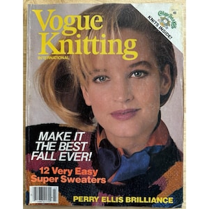 May include: A vintage Vogue Knitting International magazine cover. The cover features a woman with blonde hair and a colorful sweater. Text includes "MAKE IT THE BEST FALL EVER!" and "12 Very Easy Super Sweaters."