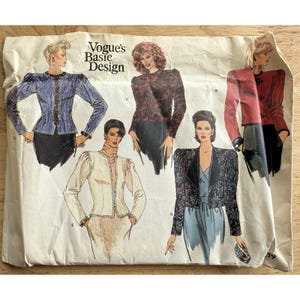 May include: Vintage Vogue's Basic Design sewing pattern featuring illustrations of five different jacket designs. The jackets vary in color and style, including a blue jacket with black trim, a red jacket, and a black jacket with floral print.