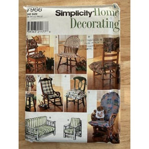 May include: A Simplicity Home Decorating pattern showing different chair designs with fabric covers. The pattern includes images of various chair styles, such as a rocking chair, a small sofa, and armchairs, offering home decor ideas.