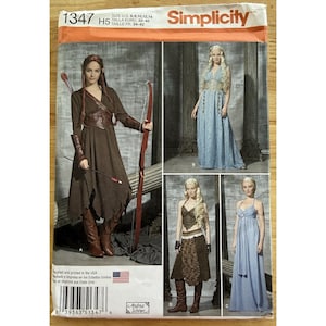 May include: Simplicity sewing pattern 1347 featuring fantasy-themed costumes. The pattern includes designs for several dresses and outfits, with a focus on medieval or fantasy aesthetics. The pattern includes sizes 6-14.