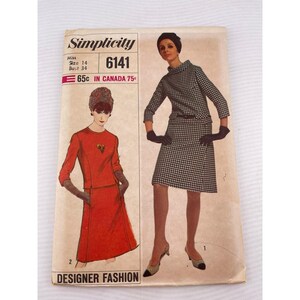 May include: Vintage Simplicity sewing pattern 6141. The pattern features two women's fashion designs. The cover has the text "Simplicity" and "Designer Fashion". The pattern is for Misses size 14, bust 34.