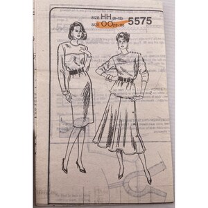 May include: Vintage sewing pattern featuring illustrations of two women's outfits. The pattern includes sizes HH (6-12) and OO (12-18), with the number 5575 visible. The outfits include a dress and a skirt with a top.