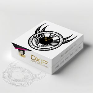 May include: A white box with a black clock face with wings and the text "DXF DECORSTUDIO" on the front. The box is labeled "Metal & Wood Laser Cut" and "DXF SVG PDF PNG JPG AI".