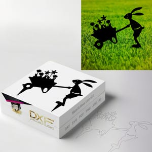 May include: Black silhouette of a rabbit pushing a wheelbarrow full of flowers. The design is for metal and wood laser cutting.  DXF SVG PDF PNG JPG AI