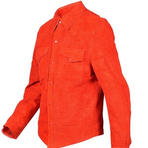May include: A bright orange suede long-sleeve shirt with a button-down front and two chest pockets.