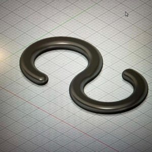May include: A dark gray, S-shaped hook with a smooth, rounded profile. The object features two curved ends that form a continuous, serpentine loop, presented against a digital grid background with a subtle, uniform texture throughout the surface.