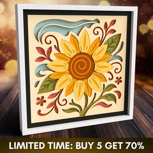 Puede incluir: Una obra de arte en papel en capas enmarcada con un diseño de girasol. La obra de arte tiene un marco blanco y un tapete negro. El girasol es amarillo y marrón, con hojas verdes y detalles en rojo. El texto "LIMITED TIME: BUY 5 GET 70%" está en la parte inferior.