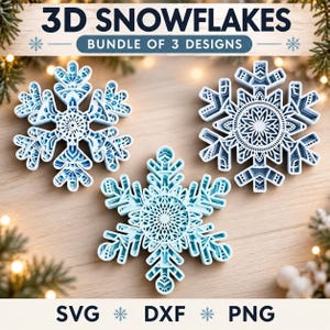 May include: Three layered 3D snowflake ornaments in shades of light blue and white. The text 3D SNOWFLAKES BUNDLE OF 3 DESIGNS is at the top, and SVG DXF PNG is at the bottom. Each snowflake features intricate geometric cutouts and depth.
