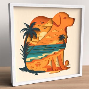 Könnte beinhalten: Gerahmtes Papierkunstwerk mit einer orangefarbenen Hundesilhouette und einer Strandszene. Die Szene zeigt einen Sonnenuntergang, Palmen und Wellen. Der Rahmen ist weiß. Das Kunstwerk ist geschichtet.
