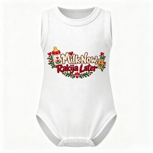 May include: A white sleeveless baby bodysuit featuring a graphic print with the text Milk Now, Rakija Later. The design includes a baby bottle, a small glass, red hearts, and green leafy sprigs arranged in a decorative floral pattern.
