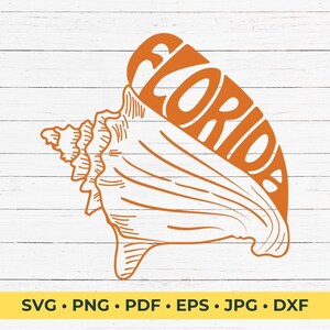 Op de afbeelding: Oranje omtrek van een schelp met het woord "Florida" geschreven in de schelp. De afbeelding is op een witte houten achtergrond.