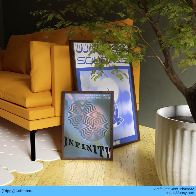 Framed "Infinity" print leaning against mustard yellow chair in cozy, plant-filled corner.