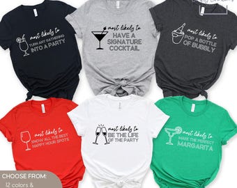 May include: A collection of six colorful t-shirts with humorous phrases and cocktail-themed graphics. The shirts are in various colors, including black, gray, red, white, and green. Text on the shirts includes "Turn Any Gathering Into A Party" and "Make The Perfect Margarita."