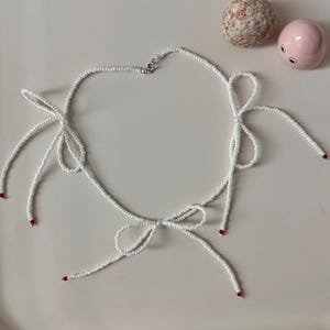 Beaded bow necklace