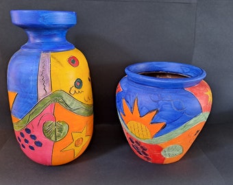 Vibrant coloured ceramic painted matching indoor  vase and plant pot set.